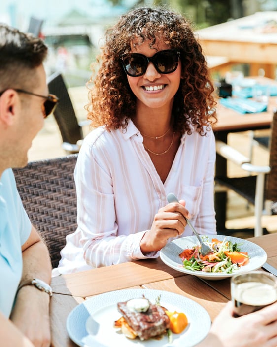 A couple dining on the patio at The View